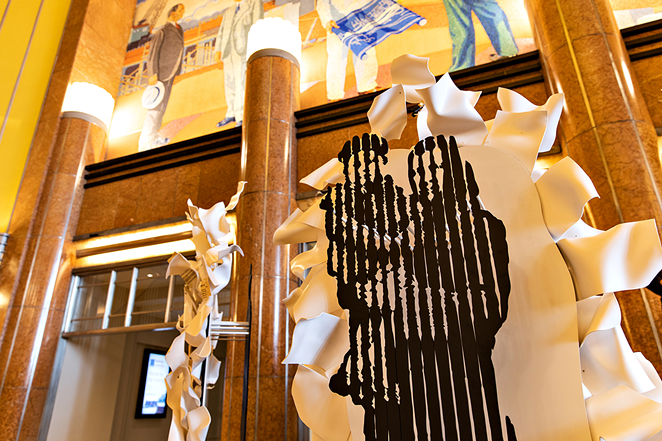 A sculpture of abstracted figures and documents on the main level of the Museum Center - Photo: Hailey Bollinger
