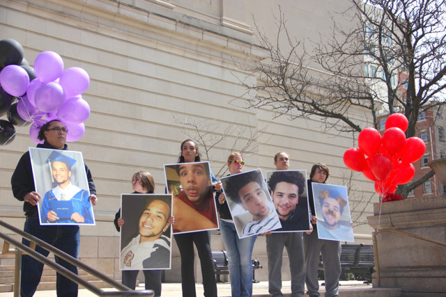 Holding signs with his photo on them, family and friends of Kevin Neri protest outside the Hamilton County Courthouse April 2. - Photo: Nick Swartsell