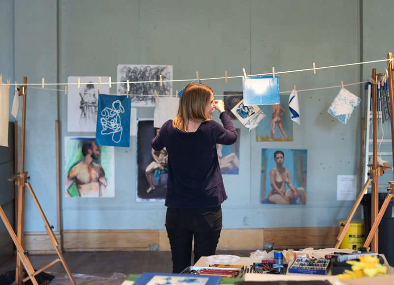 Kate Cunningham hangs light-developed cyanotype prints at Manifest Drawing Center. - Photo: Khoi Nguyen