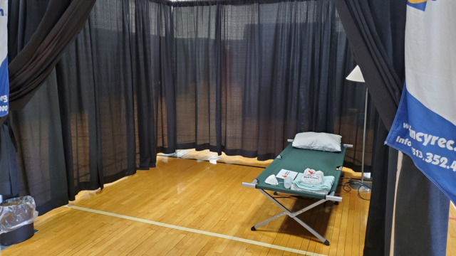 A bed set up in the OTR Community Center for those experiencing homelessness and exhibiting possible COVID-19 symptoms - Photo: Nick Swartsell