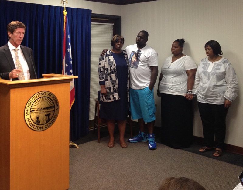 Mark O'Mara, left, speaks at a press conference as the family of Samuel Dubose looks on.