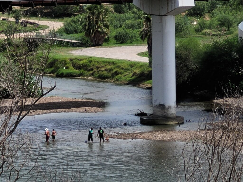 People cooling off in the Rio Grande last week just across from Roma, Texas. Mike DeWine and other Republican governors are sending cops to the border, but experts and residents there say the governors are falsely portraying a humanitarian crisis as a crime wave. - Photo: Marty Schladen, Ohio Capital Journal