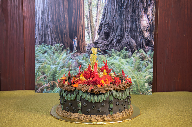 The "campy" cake with edible celosia. "Parsnip carrot cake spiced with star anise, sour cream toasted pecan filling, chili dulce de leche buttercream," according to the Calliope description. - Photo: Scott Beseler