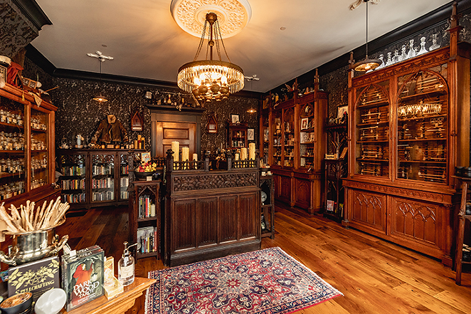 “Our wands cabinet (far right) tends to be a focal point,” Coil says. - Photo: Hailey Bollinger