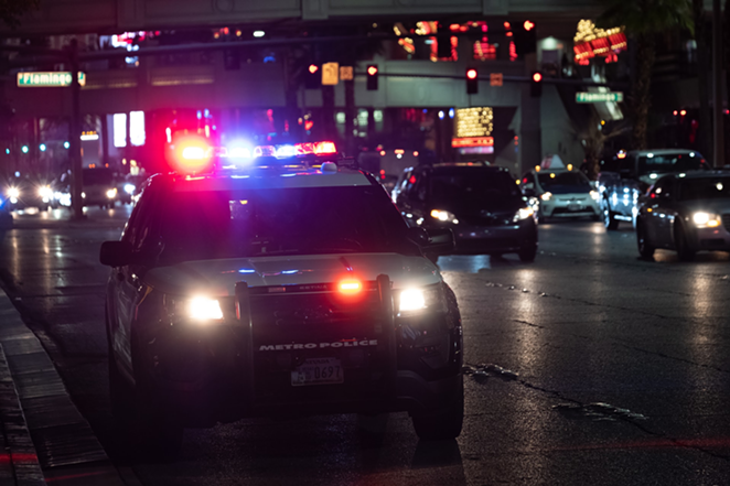 Police car lights in the dark - Photo: NeONBRAND, Unsplash