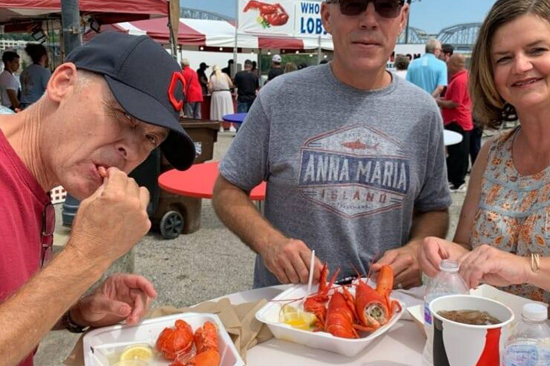 Folks chowing down on some lobster - Photo: Instagram.com/greatinlandseafoodfestival