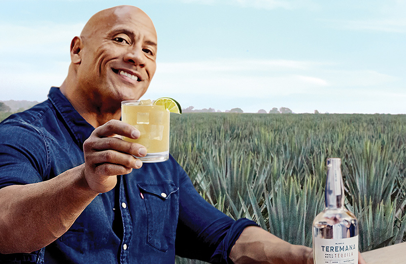 The Rock cheers-ing you with a glass of his Teremana Tequila. - PHOTO: PROVIDED BY TEREMANA TEQUILA