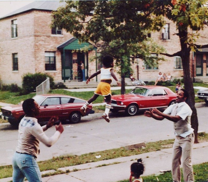 Family members throw Jerald Cooper into the air in 1985. - Photo: Provided by Jerald Cooper/@hoodmidcenturymodern