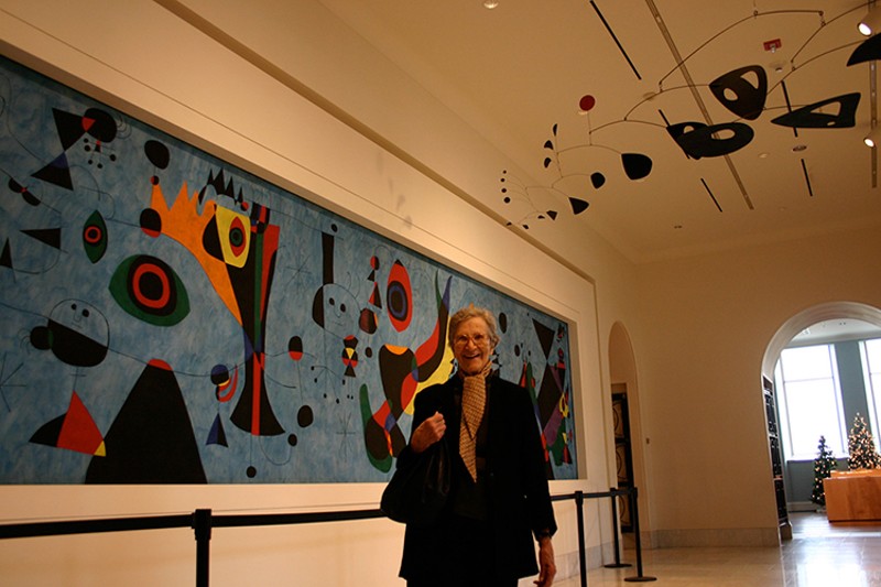 Natalie de Blois with the Terrace Plaza Miró mural and Calder mobile at the Cincinnati Art Museum - Photo: Shawn Tubb, Courtesy Cincinnati Preservation Association