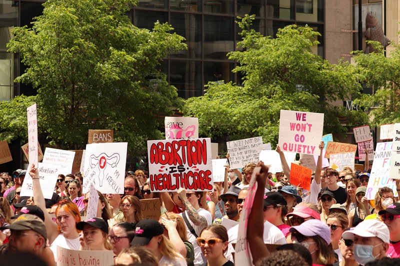 Demonstrators hold signs during Planned Parenthood's 'Bans Off Our Bodies' abortion rights rally in Cincinnati in May 2022. - Photo: Mary LeBus