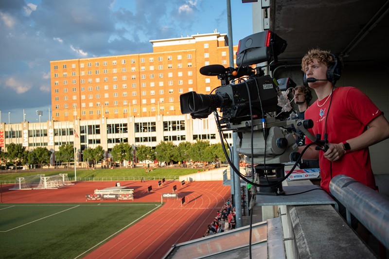 University of Cincinnati student Mason Foley operates a camera at Gettler Stadium in August 2022 for a broadcast for ESPN+. - Photo: Michael Asher