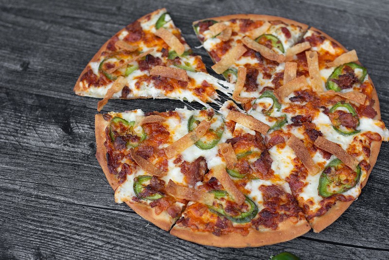 MacKenzie River Pizza, Grill & Pub is serving up the Jalapeño Popper Pie for Cincinnati Pizza Week. It's a 10-inch pizza with jalapeño cream cheese, smoky bacon, fresh jalapeños, mozzarella and cheddar and topped with crispy strips. - Photo: Provided by MacKenzie River Pizza, Grill & Pub