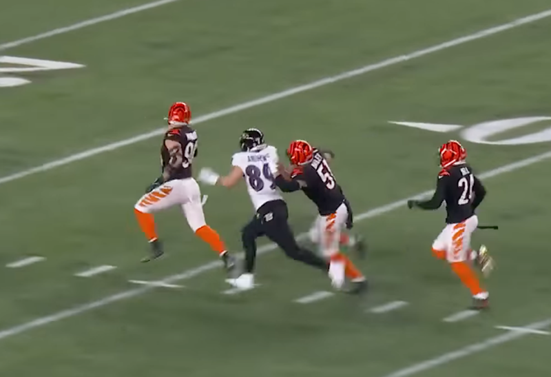 Cincinnati Bengals defensive end Sam Hubbard (94) sprints for a touchdown as linebacker Markus Bailey (51) prevents Baltimore Ravens tight end Mark Andrews (89) from tackling him on Jan. 15, 2023. - Photo: NFL on NBC, YouTube