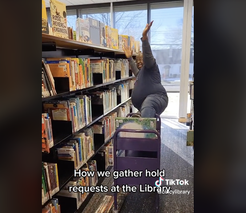 Library employee Kelwin Hester shows off his moves for the Cincinnati & Hamilton County Public Library's TikTok page. - Photo: Screenshot from tiktok.com/@cincylibrary