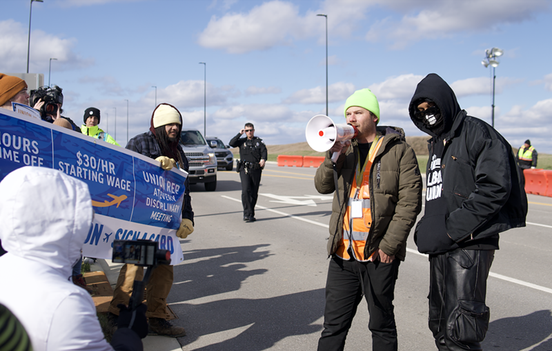 Amazon Air Hub union organizer Griffin Ritze addresses a crowd of Air Hub workers and supporters during a March 18 rally. - Photo: Aidan Mahoney