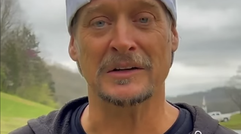 Kid Rock posted a video to his Instagram showing him wearing his own (dirty) merch and a MAGA hat and whining about Bud Light after shooting a few cases of the beer with an automatic rifle. - Photo: Screenshot, Kid Rock's Instagram