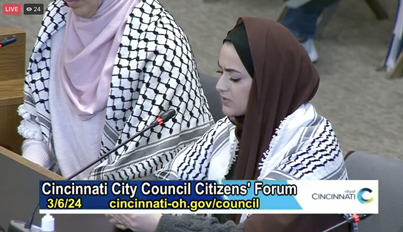 A guest speaker tells Cincinnati City Council that a temporary ceasefire resolution is "not enough" during a March 6 meeting. - Photo: CitiCable