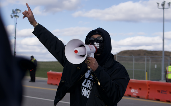 Amazon Labor Union Chris Smalls addresses a crowd of KCVG workers and supporters during a March 18 rally outside Hebron, Kentucky's Amazon Air Hub.