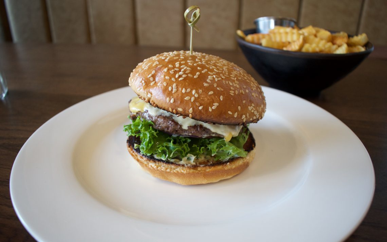 The Goose & Elder burger: Grass-fed burger, American cheese, lettuce, tomato, onion, pickles, Dijonnaisse, sesame seed bun