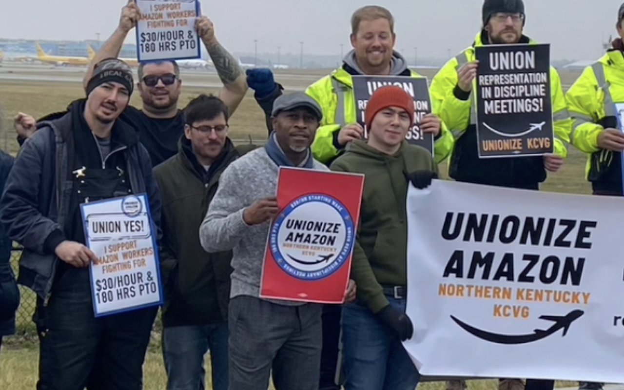 Edward Clarke (center, grey hat) says he was fired from his job at the Amazon Air Hub facility in Hebron, Kentucky for union organizing. Amazon's spokesperson disputes this.