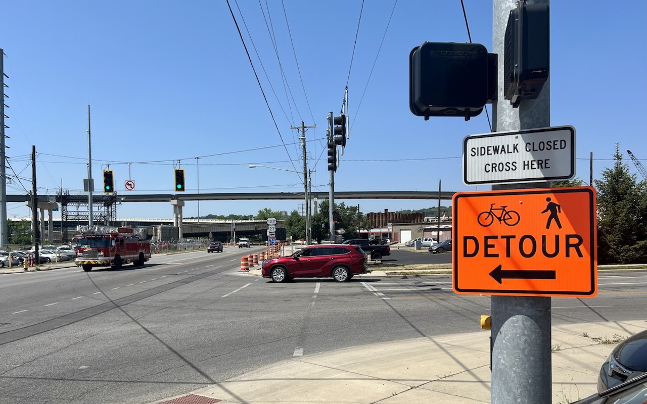 The southbound bike lane on Spring Grove is blocked by orange barrels between Elmore Street and Millcreek Road, causing confusion for some cyclists who assume they should detour to the opposite bike lane.