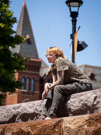 Milo, a local resident, sits atop the waterfall staircase at Washington Park. Milo is an artist in Cincinnati and was spending their free time before work basking in the sun and soaking their feet in the fountain. Milo works at the Contemporary Art Museum as a receptionist. “I didn’t really have a plan before I got here. I just wandered up and saw that they turned the fountains on," they said.