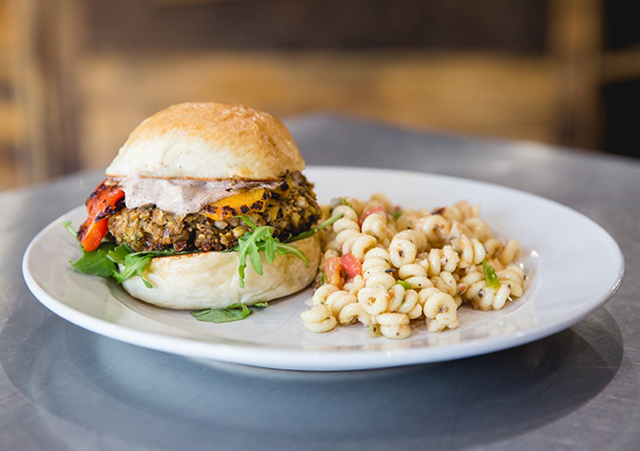 Not your Mama's Veggie Burger: baked falafel, roasted peppers, arugula, harrisa crema on a toasted roll with a side of pasta salad
