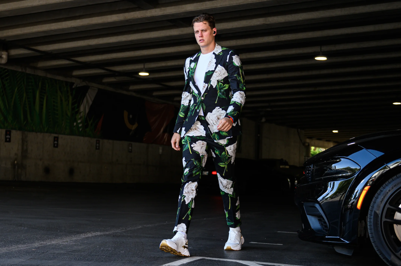 Cincinnati Bengals quarterback Joe Burrow wears a floral suit before the game against the Miami Dolphins on Sept. 29, 2022.