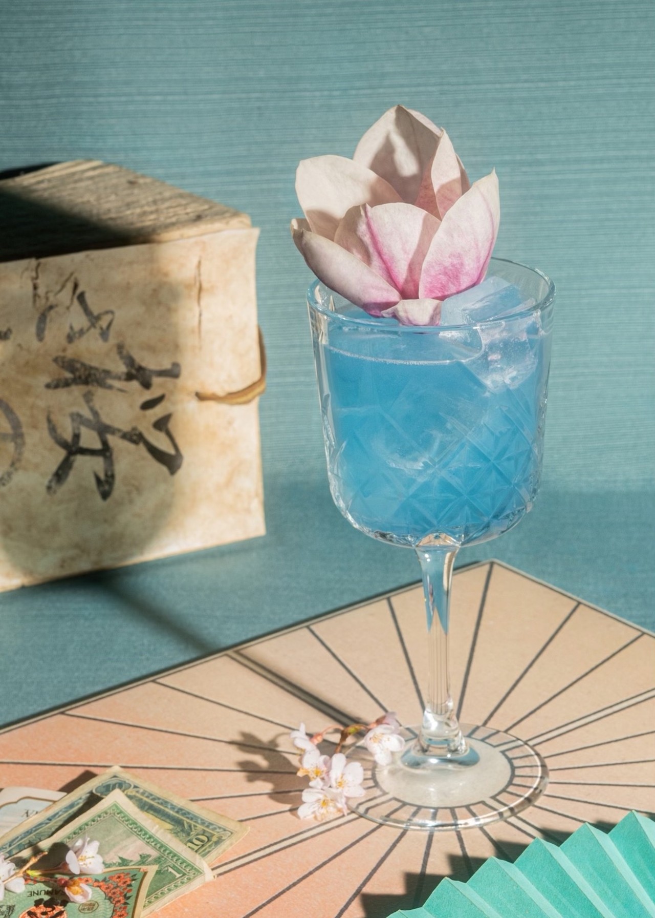 Sakura Spritz
What's in it: Butterfly pea tea-infused vodka, sake, sakura + blue spirulina syrup, lemon and electrolytes