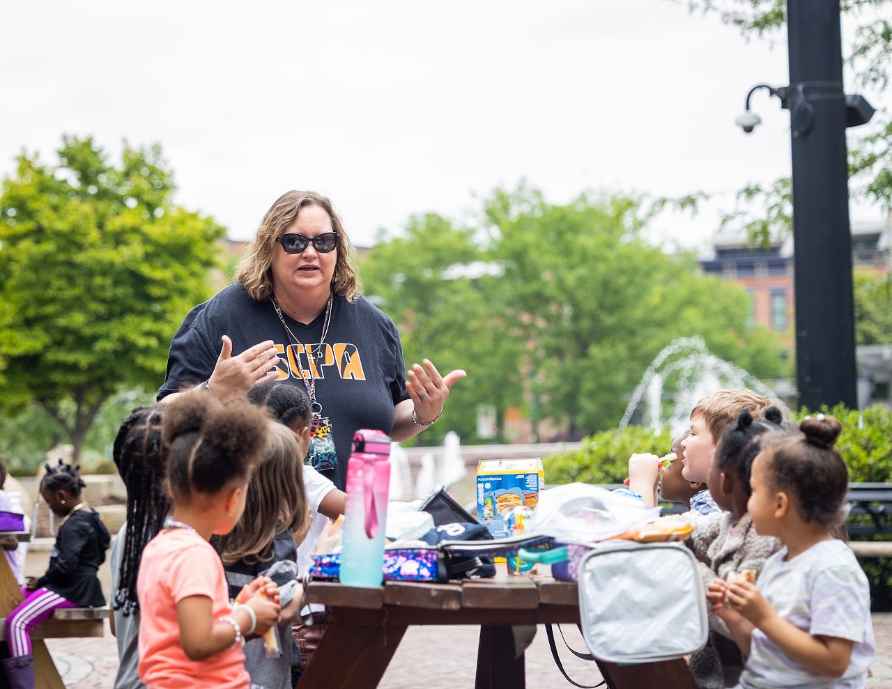 Local elementary students go to the park and eat lunch before attending a live theater performance. For the protection of the children, the teacher and school asked to remain anonymous.