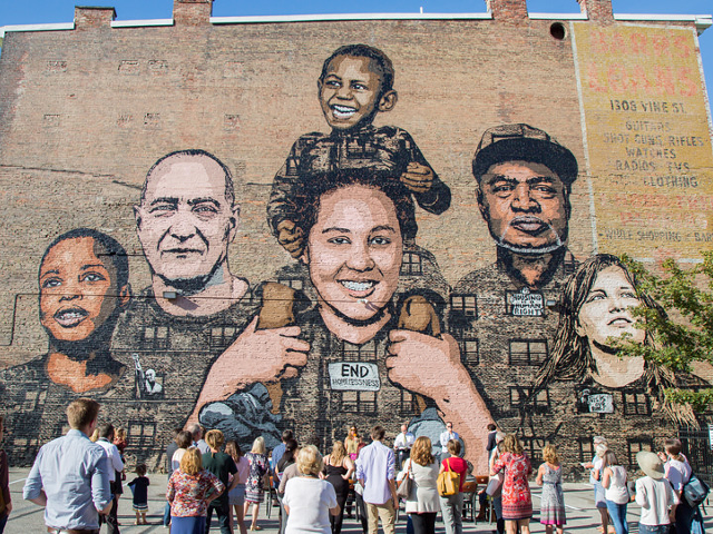 "Faces of Homelessness" is just one of Cincinnati's many murals that have garnered national attention.