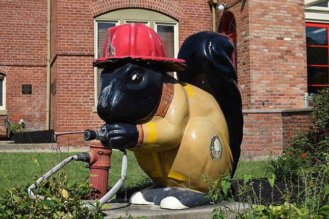 "Scrappy Fritz Kloth" the firefighter stands sentry outside Town Hall on Sharon Avenue.