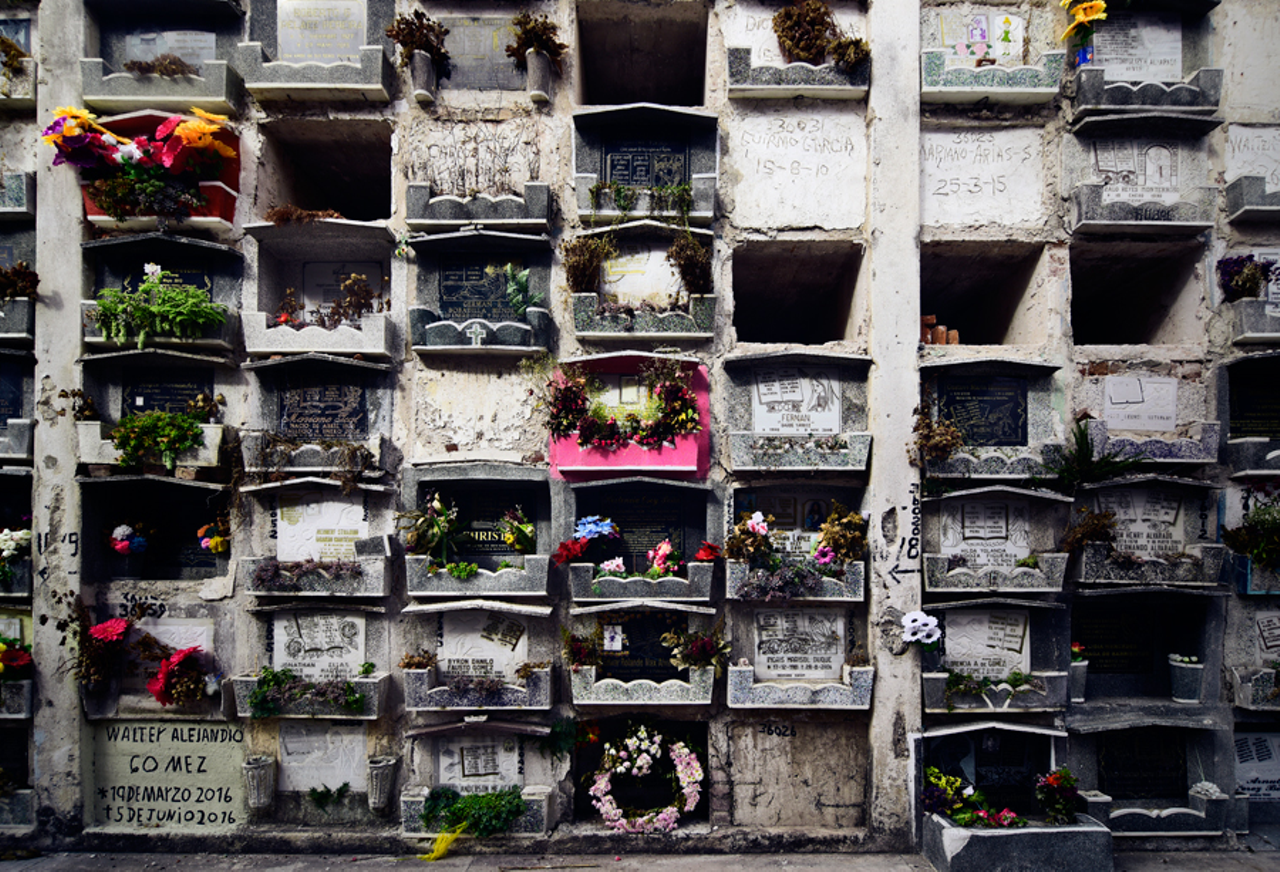The stacked tombs of the poor in a Guatemalan cemetery. “They get to have a ceremony and burial, but seven years later they take the remains out and put them in a mass grave,” Jeremiah says.